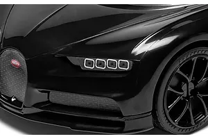 Close-up of the front end, headlight, and black wheel of the Airfix Bugatti Chiron model car.