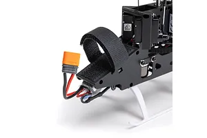Close-up of the front battery compartment and orange IC2 connector on the Blade Revolution 155 CP RC helicopter.