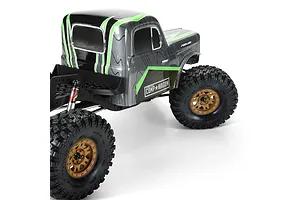 Pro-Line crawler tyres fitted on bronze rims attached to an RC crawler vehicle with a custom grey and green cab body.