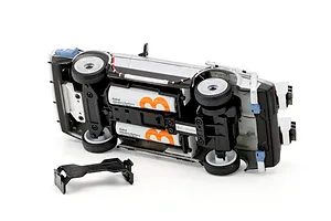 Underside view of the Kyosho First Mini-Z Back to the Future DeLorean RC car showing battery compartment and detached battery door.
