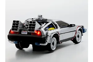 Rear three-quarter studio view of the Kyosho First Mini-Z Back to the Future DeLorean RC car showing lit tail lights and time machine details.