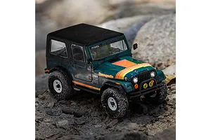 Green Axial SCX30 Jeep CJ-7 Renegade RC rock crawler crawling over rocks in an outdoor environment.