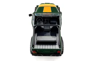 Top-down rear angle view of the green Axial SCX30 Jeep CJ-7 Renegade RC rock crawler showing interior cockpit, roll cage, and dashboard detail.
