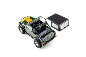 High-angle view of the green Axial SCX30 Jeep CJ-7 Renegade RC rock crawler with its removable black hardtop placed beside it.