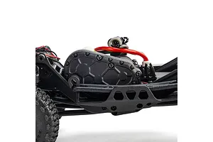 Close-up side view of the black chassis, transmission case, and wiring of an Axial SCX30 RC rock crawler.