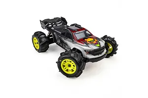 Pro-Line 1/16 Dumont paddle tyres mounted on yellow split-six wheels installed on an RC monster truck against a white background.