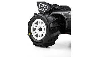 Pro-Line Dumont MT paddle tyre mounted on a white split-six rim installed on an RC vehicle against a white background.