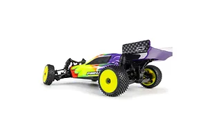 Pro-Line 1/24 scale RC buggy mounted with Wedge front and Prism rear tyres on bright yellow dish rims, viewed from rear-three-quarter angle.