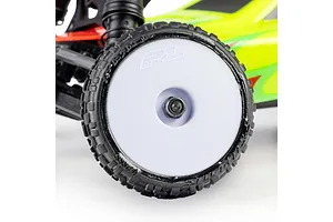 Close-up of a Pro-Line RC buggy wheel mounted with a patterned tyre and white rim on a vehicle chassis.