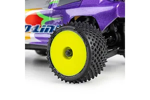 Pro-Line Prism carpet tyre mounted on a bright yellow dish rim installed on an RC car.