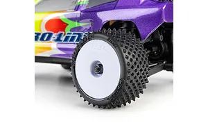 Close-up of a Pro-Line carpet tyre mounted on a white dish rim installed on a mini RC car.