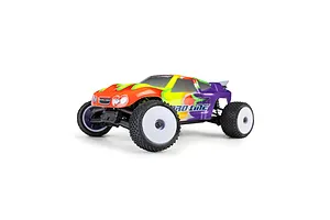 Pro-Line 1/28 RC stadium truck fitted with Prism carpet tyres on white dish rims against a white background.