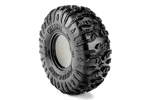 Pro-Line 1.9 crawler tyre featuring aggressive tread pattern and embossed sidewall lettering on white background.