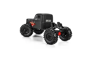 Pro-Line matte black cab-only crawler body mounted on an RC chassis with large off-road tires against a white background.