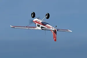 Inverted flight of the Arrows RC Bigfoot 1.3m trainer airplane against a clear blue sky.