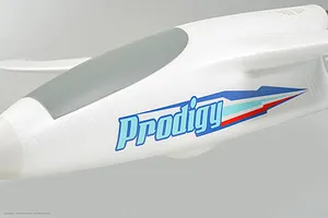 Close-up of the white foam fuselage of the Arrows RC Prodigy trainer plane showing the blue Prodigy logo.