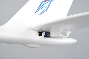 Close-up of the tail section of the Arrows RC Prodigy trainer plane showing the servo and linkage.