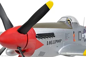Close-up of the front fuselage and cockpit of the Arrows RC P-51 Mustang model airplane showing nose art and red spinner.