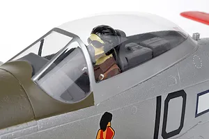 Close-up of the cockpit and pilot figure on the Arrows RC P-51 Mustang 850mm plane against a white background.