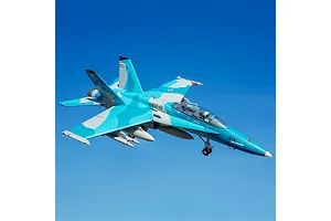 FMS F/A-18 Hornet RC jet flying against a clear blue sky background