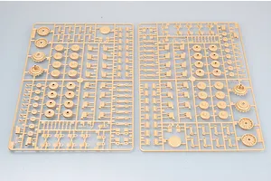 Two tan plastic model kit sprues featuring various wheels, suspension arms, and small mechanical parts for a military vehicle model.