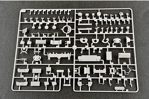 A grey plastic sprue containing various small parts for a 1/35 scale model tank kit, laid out on a dark grey surface.
