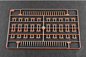 A brown plastic sprue containing numerous small tank track link parts for a 1/35 scale model kit.