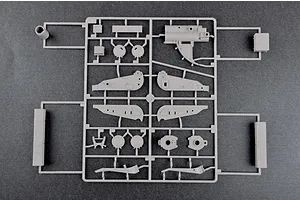A grey plastic sprue containing various model kit parts for a 1/35 scale military vehicle, viewed from directly above against a dark grey background.