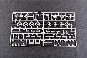 A grey plastic sprue containing various model tank road wheels, sprockets, and small mechanical parts for a 1/35 scale model kit.