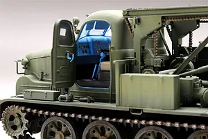 Side view of a 1/35 scale Trumpeter BTM-3 trench digger model showing the open cabin door and detailed interior.