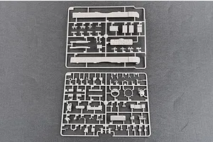 Two grey plastic model kit sprues containing various tank parts laid out on a dark grey surface.