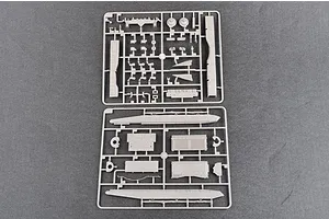 Two grey plastic model kit sprues containing various tank parts laid out on a dark grey surface.