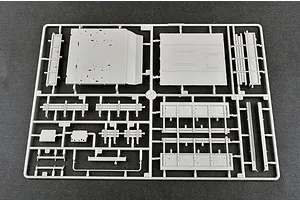 A grey plastic sprue from a 1/35 scale model kit containing various flat panels and structural parts for a military vehicle.