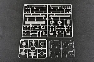Three plastic model kit sprues for a 1/35 scale military vehicle, including two grey plastic frames and one clear plastic frame on a dark background.