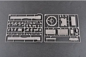Two grey plastic model kit sprues containing various tank parts laid out on a dark grey surface.