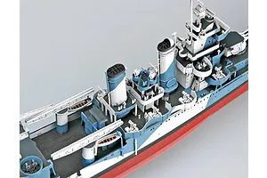 A high-angle view of a detailed 1/350 scale plastic model of the USS San Francisco heavy cruiser, showing the deck, funnels, and superstructure.