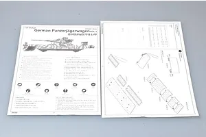 Instruction manual pages for the Trumpeter 1/35 scale German Panzerjagerwagen model kit, showing assembly diagrams and safety information.