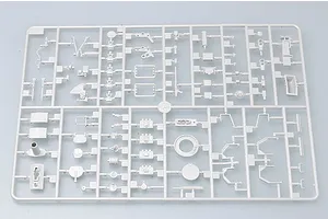 A light grey plastic model kit sprue containing various small parts for a 1/35 scale military vehicle model.