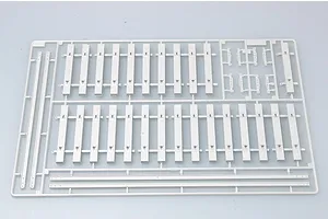 A grey plastic model kit sprue containing railway track sections and sleepers for a 1/35 scale armoured train model.