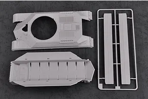 Plastic model kit parts for a Soviet T-10M tank, including the upper hull, lower hull, and a sprue with side panels on a dark textured background.