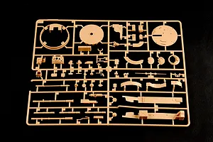 A tan plastic model kit sprue containing various tank parts for a 1/35 scale Russian BMP-3 model, set against a black background.
