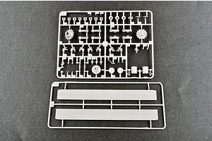 Two grey plastic model kit sprues containing various tank parts, including suspension components and side panels, on a dark grey background.