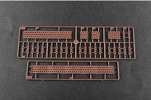 Two brown plastic sprues containing individual tank track links for a 1/35 scale model kit.