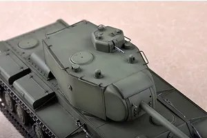 High-angle view of a painted olive green 1/35 scale Russian KV-220 tank model kit showing the turret, gun barrel, and upper hull details.