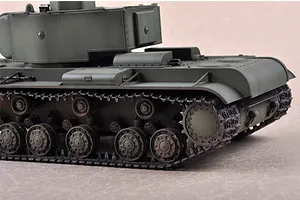 A close-up side view of a 1/35 scale model of a Russian KV-220 tank, showing the olive green hull, turret, and detailed track assembly.