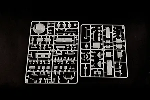 Two grey plastic model kit sprues containing various vehicle parts for a 1/35 scale BTR-60PB model, laid out on a black background.