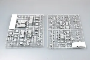 Two grey plastic model kit sprues containing various vehicle parts for a 1/35 scale military truck model.