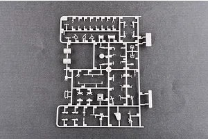 A grey plastic sprue containing various small parts for a 1/35 scale model tank kit, viewed from directly above against a dark grey background.
