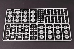A grey plastic sprue containing various tank road wheels and suspension components for a 1/35 scale model kit.