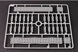 A grey plastic sprue containing individual tank track links and track segments for a 1/35 scale model kit.